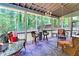 Relaxing screened porch offering comfortable seating, views of the backyard and nature at 3320 Bryant Ln, Marietta, GA 30066