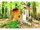 Outdoor shed with a white door, white picket fence, and decorative features at 3320 Bryant Ln, Marietta, GA 30066