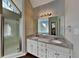 Modern bathroom featuring double sinks, a walk-in shower, and a soaking tub at 4397 Windsor Oaks Cir, Marietta, GA 30066