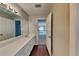 Bathroom vanity with a large mirror and wood floors at 4397 Windsor Oaks Cir, Marietta, GA 30066