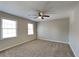 Spacious bedroom featuring carpet floors and natural light at 4397 Windsor Oaks Cir, Marietta, GA 30066