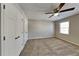 Bedroom with carpet floors, ceiling fan and a window providing ample natural light at 4397 Windsor Oaks Cir, Marietta, GA 30066