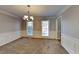 Elegant dining room featuring neutral paint, plush carpet, and crown molding at 4397 Windsor Oaks Cir, Marietta, GA 30066