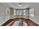 Elegant dining room featuring dark hardwood floors and natural light at 4397 Windsor Oaks Cir, Marietta, GA 30066