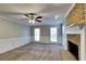 Bright living room with a brick fireplace, neutral paint, and plush carpet at 4397 Windsor Oaks Cir, Marietta, GA 30066