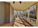 Sun-filled screened porch with wood floors and an expansive view of the tree line at 4397 Windsor Oaks Cir, Marietta, GA 30066
