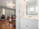 Half bathroom showcasing a single vanity, with a decorative mirror and natural light at 4865 Fenbrook Dr, Stone Mountain, GA 30088