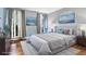 Serene bedroom with plush bedding, soft lighting, and calming artwork at 4865 Fenbrook Dr, Stone Mountain, GA 30088