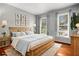 Inviting bedroom with a wooden bed frame, warm lighting, and comfortable accents at 4865 Fenbrook Dr, Stone Mountain, GA 30088