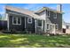 Charming exterior with gray siding, well-maintained lawn, and a small patio area, great for outdoor enjoyment at 4865 Fenbrook Dr, Stone Mountain, GA 30088
