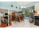 Charming eat-in kitchen featuring a tile floor, bright paint, and a view into the living room at 4865 Fenbrook Dr, Stone Mountain, GA 30088