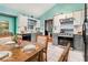 Charming kitchen with white cabinets, gray appliances, and a cozy breakfast nook at 4865 Fenbrook Dr, Stone Mountain, GA 30088