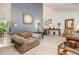 Bright living room boasting high ceilings, neutral walls, and a mix of stylish furnishings for a cozy yet elegant ambiance at 4865 Fenbrook Dr, Stone Mountain, GA 30088