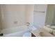 Clean bathroom featuring a tub, toilet, and sink with a mirror at 783 Fox Valley Dr, Stone Mountain, GA 30088