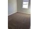 Neutral bedroom with a plush carpet and a window for natural light at 783 Fox Valley Dr, Stone Mountain, GA 30088
