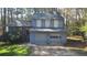 Charming two-story home with an attached two-car garage and well-kept front lawn at 783 Fox Valley Dr, Stone Mountain, GA 30088