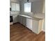 Well-lit kitchen space with standard appliances, white cabinets and countertops, offering functionality at 783 Fox Valley Dr, Stone Mountain, GA 30088