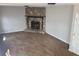 Living room with a stone fireplace, neutral walls, carpet, and a door at 783 Fox Valley Dr, Stone Mountain, GA 30088