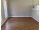 Neutral living room with windows bringing in natural light and wood flooring at 783 Fox Valley Dr, Stone Mountain, GA 30088