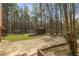 Expansive backyard with a trampoline and gazebo nestled among towering trees at 100 Hall Pl, Fayetteville, GA 30215