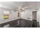 Bedroom with black tile floor, neutral walls, and a ceiling fan for added comfort at 100 Hall Pl, Fayetteville, GA 30215