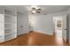 Spacious bedroom featuring hardwood floors, neutral walls, and ample closet space at 100 Hall Pl, Fayetteville, GA 30215