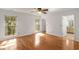 Large, sunny bedroom with hardwood floors and a connecting bathroom suite at 100 Hall Pl, Fayetteville, GA 30215