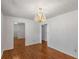 Dining room with hardwood floors and chandelier lighting at 100 Hall Pl, Fayetteville, GA 30215