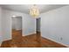 Dining room with hardwood floors and chandelier lighting at 100 Hall Pl, Fayetteville, GA 30215