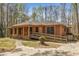 Beautiful brick home with a ramp, front porch, and tasteful landscaping in a serene setting at 100 Hall Pl, Fayetteville, GA 30215