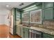 Bright kitchen featuring custom cabinets, stainless steel appliances, granite counters, and natural light at 100 Hall Pl, Fayetteville, GA 30215