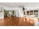 Open concept living room with hardwood floors and view of kitchen at 100 Hall Pl, Fayetteville, GA 30215