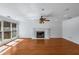 Spacious living room with hardwood floors and a cozy fireplace at 100 Hall Pl, Fayetteville, GA 30215