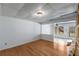 Room with wood flooring, white walls, and an opening that leads to the sunroom at 100 Hall Pl, Fayetteville, GA 30215