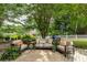 Cozy backyard patio featuring cushioned seating, colorful pillows, and decorative plants at 285 Lackland Court, Sandy Springs, GA 30350