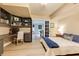 Bedroom featuring a desk and shelving, a bed with blue accents, and french doors leading outside at 285 Lackland Court, Sandy Springs, GA 30350
