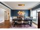 Dining room featuring navy walls, modern lighting, and a large window at 285 Lackland Court, Sandy Springs, GA 30350
