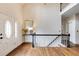 Welcoming two-story foyer with hardwood floors, decorative front door, staircase, and elegant console table at 285 Lackland Court, Sandy Springs, GA 30350
