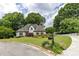 Beautifully landscaped front yard with a well-maintained lawn and mature trees at 285 Lackland Court, Sandy Springs, GA 30350
