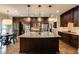 Gourmet kitchen featuring granite countertops, dark wood cabinets, stainless steel appliances, and breakfast nook at 285 Lackland Court, Sandy Springs, GA 30350