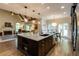 Gourmet kitchen with granite countertops, dark wood cabinets, an oversized island, and stainless steel appliances at 285 Lackland Court, Sandy Springs, GA 30350