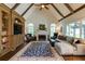 Spacious living room features vaulted ceilings, built-in shelving, fireplace, and hardwood floors at 285 Lackland Court, Sandy Springs, GA 30350
