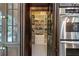 Walk-in pantry includes lots of storage with custom shelving and storage for small appliances at 285 Lackland Court, Sandy Springs, GA 30350