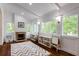 Bright playroom featuring multiple windows, a fireplace, and built-in shelves at 285 Lackland Court, Sandy Springs, GA 30350