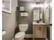 Charming powder room featuring modern fixtures, a stylish mirror, and wall decor at 285 Lackland Court, Sandy Springs, GA 30350