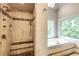 Luxurious tiled shower with bench and garden tub under a skylight offering natural light at 285 Lackland Court, Sandy Springs, GA 30350