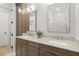 Modern bathroom featuring double sinks, shaker cabinets, and bright lighting at 8240 Sonata Ln, Cumming, GA 30041
