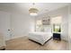 Relaxing bedroom with natural light, hardwood floors, and neutral decor at 8240 Sonata Ln, Cumming, GA 30041