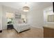 Calming bedroom with neutral tones, a large window, and hardwood floors at 8240 Sonata Ln, Cumming, GA 30041