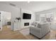 Inviting living room features a fireplace, large windows, and stylish furniture at 8240 Sonata Ln, Cumming, GA 30041